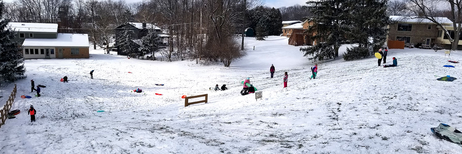 Panorama of Sledding on Back of Dam